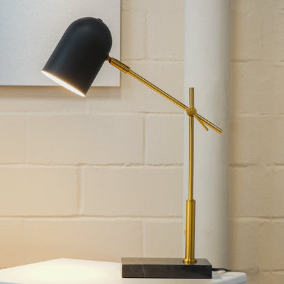 Lumora table lamp black shade with brass arms atop a black marble base on Tampa Home & Garden Store
