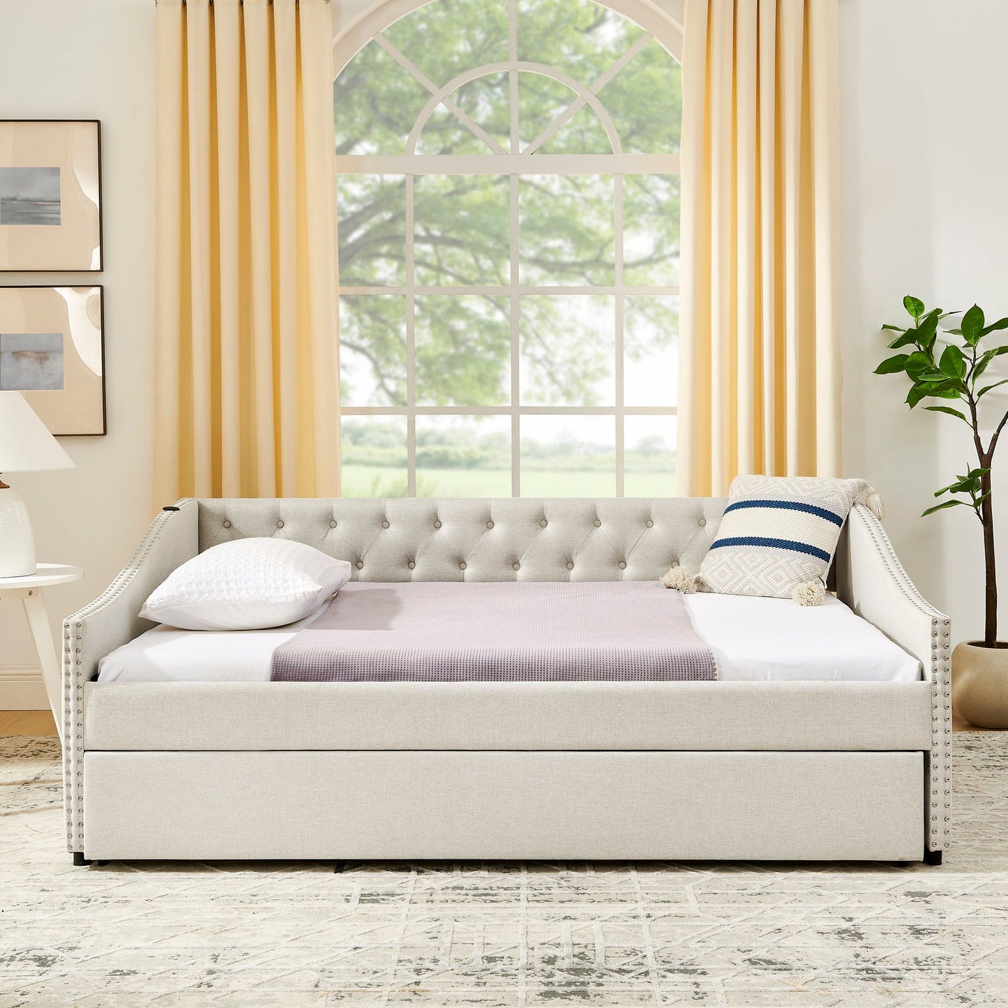 Upholstered daybed in grey fabric with tufted back and nailhead trim, pull-out bed on Tampa Home & Garden Store