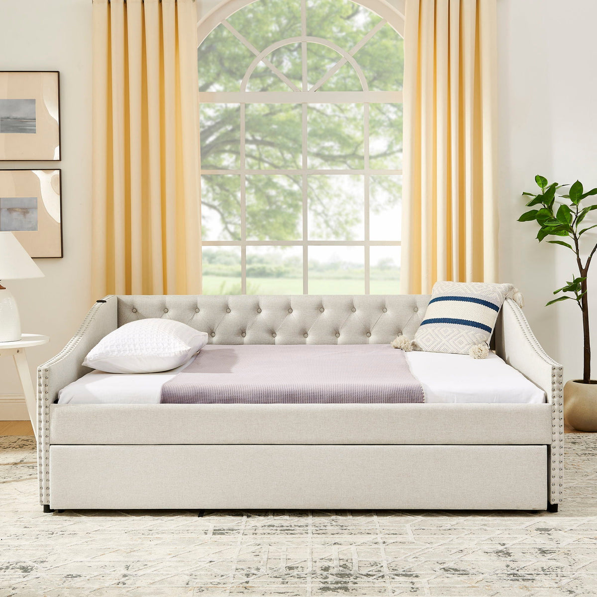Upholstered daybed in grey fabric with tufted back and nailhead trim, pull-out bed on Tampa Home & Garden Store