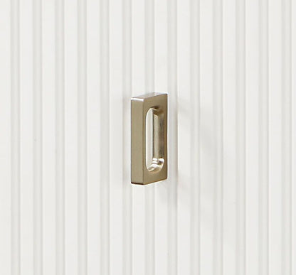 Carena Chest drawer pull in brass finish mounted on white beadboard panel on Tampa Home & Garden Store