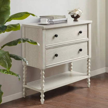 Signature Beckett 2-Drawer Accent Chest, lightwash wood finish, black knob pulls on turned legs on Tampa Home & Garden Store