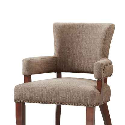 Elegant arm dining chair with brown textured fabric and brass nailhead trim on Tampa Home & Garden Store