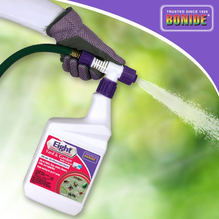 Bonide Eight Yard & Garden Ready To Spray bottle with purple nozzle held by a gloved hand on Tampa Home & Garden Store