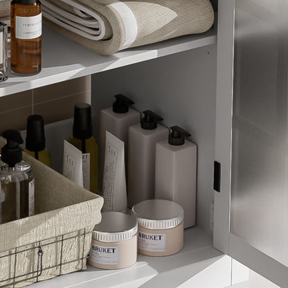 Vanities: rolled beige towel with amber bottles on shelf by HouseOfZazla on Tampa Home & Garden Store