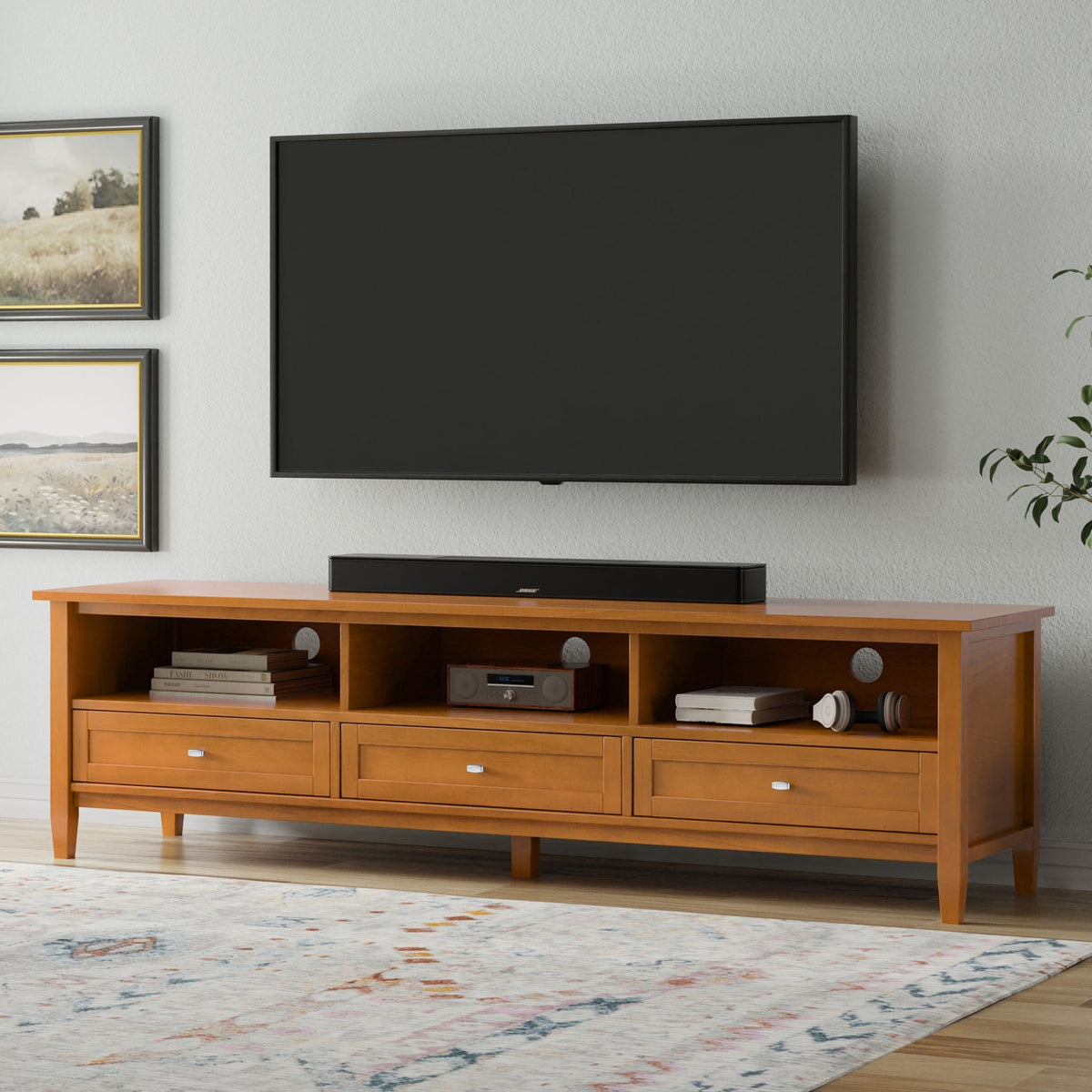 Shaker TV Stand and Solid Wood Media Console with warm wood finish, black TV, Bose soundbar on Tampa Home & Garden Store