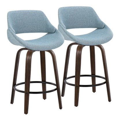 Pair of mid-century counter stools in blue fabric with dark wood legs and round footrests on Tampa Home & Garden Store