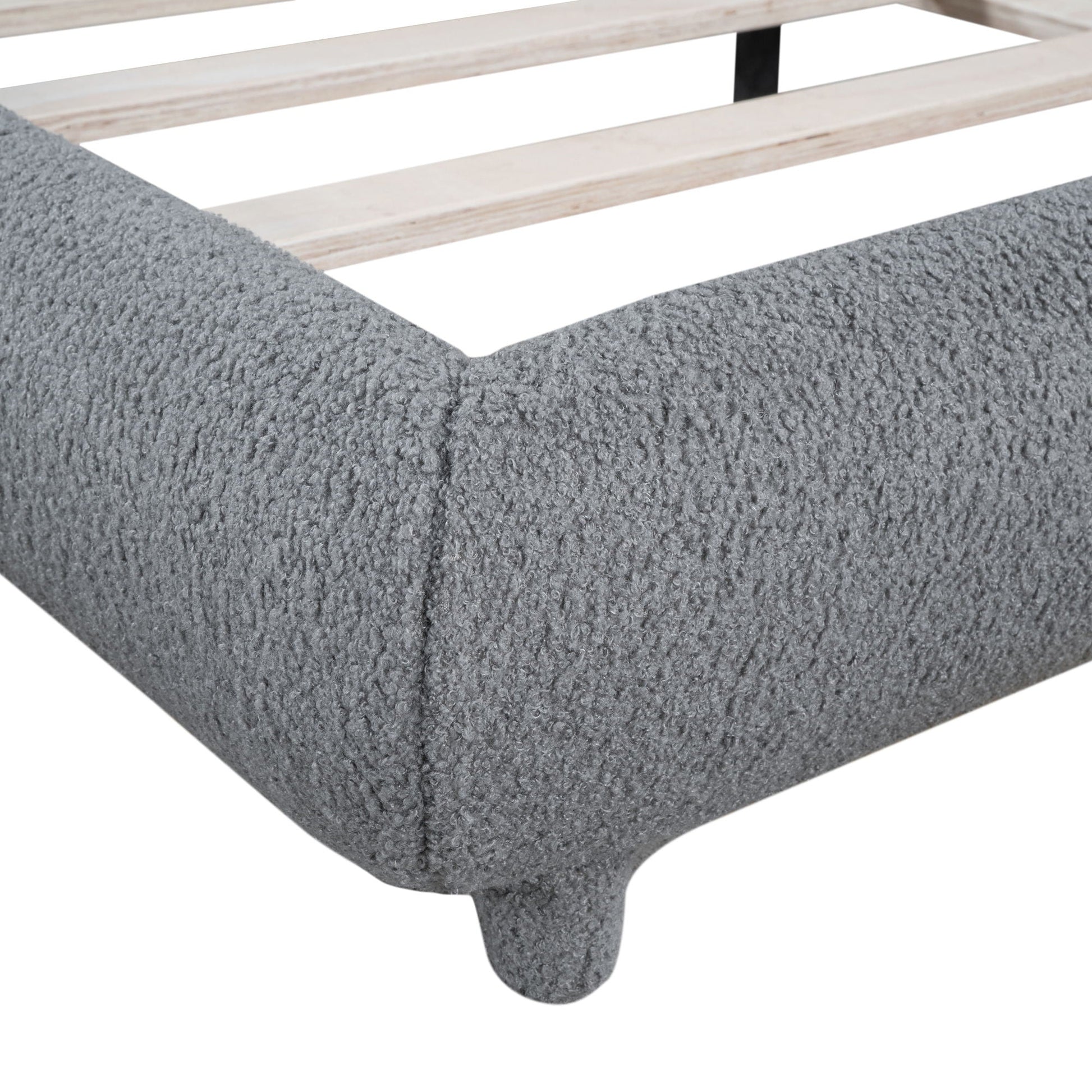 Upholstered platform bed with thick solid frame and curved gray fabric foot on Tampa Home & Garden Store