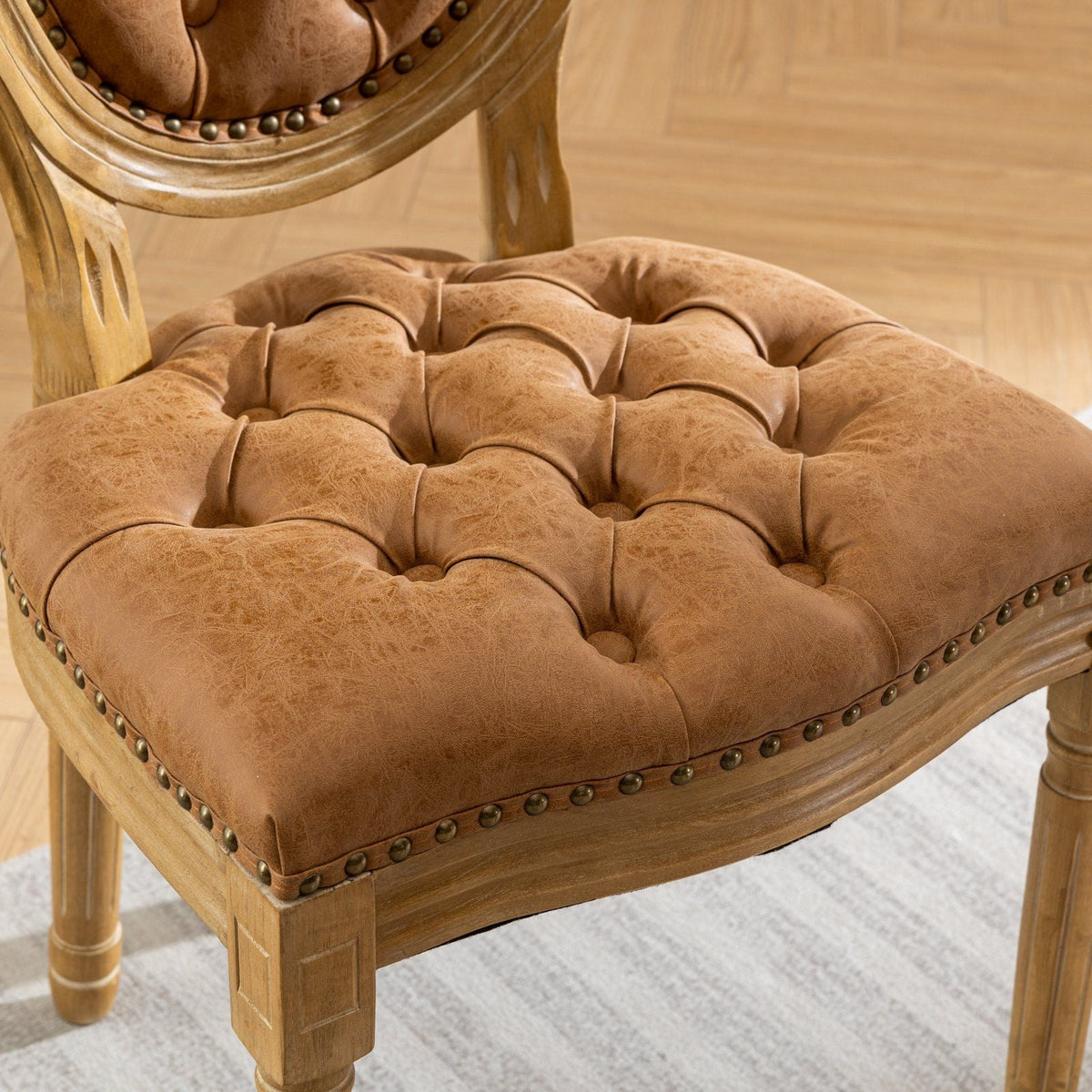 French style solid wood dining chair with tufted tan leather seat and nailhead trim on Tampa Home & Garden Store