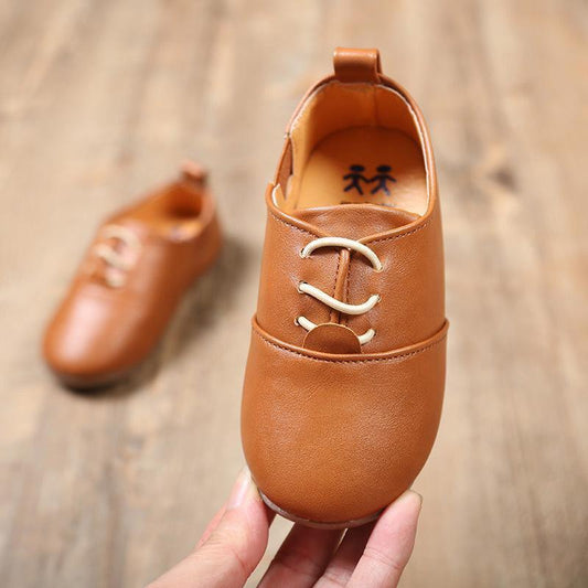 Two brown leather children's lace-up shoes by Stevvex for babies and toddlers on Tampa Home & Garden Store