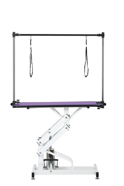 Hydraulic pet grooming table with H-arm, purple tabletop, white scissor-lift base and straps on Tampa Home & Garden Store