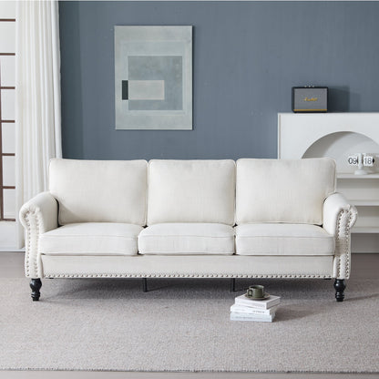 83-inch rolled-arm sofa in cream fabric with nailhead trim and dark turned legs on Tampa Home & Garden Store