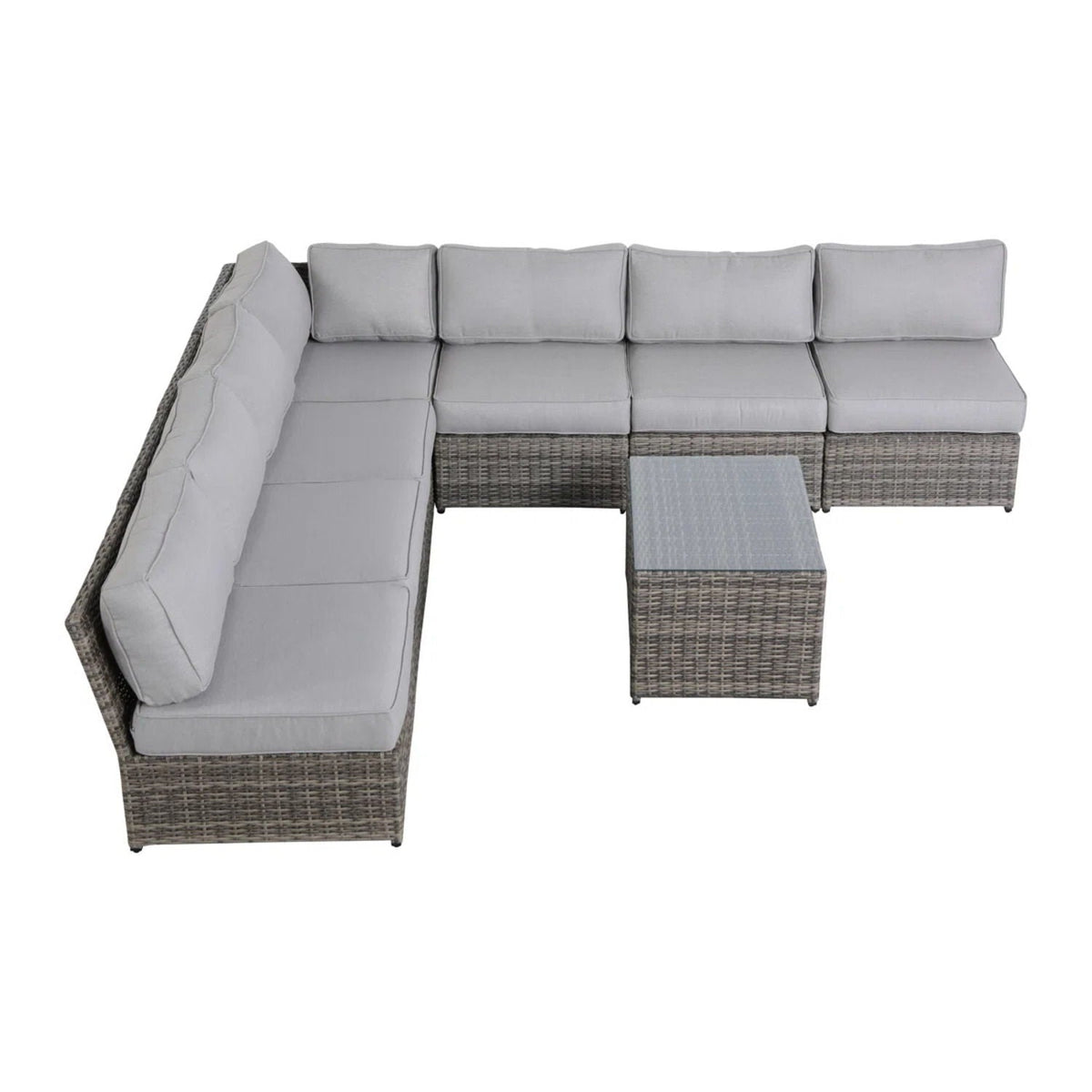Comfortable patio rattan sectional with light gray cushions and glass coffee table on Tampa Home & Garden Store