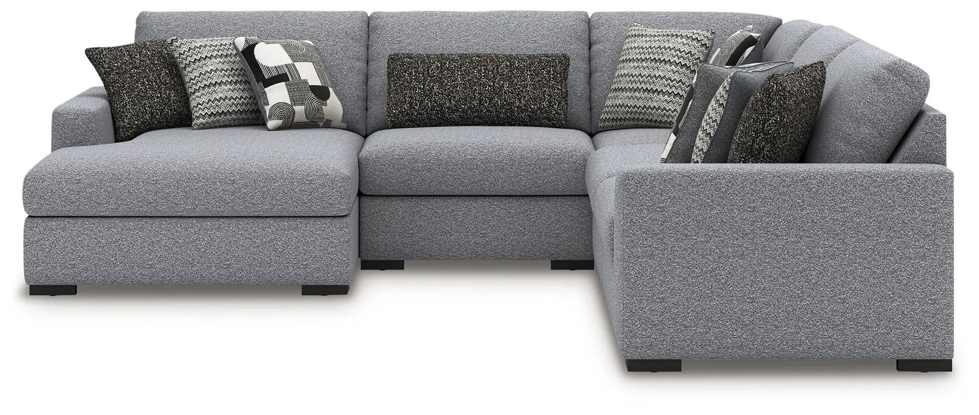 Bealton sectional by Unique Piece Furniture in light gray textured fabric with pillows on Tampa Home & Garden Store