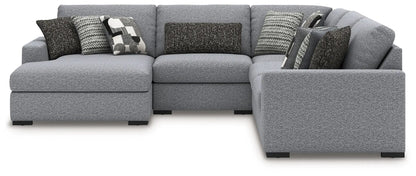 Bealton sectional by Unique Piece Furniture in light gray textured fabric with pillows on Tampa Home & Garden Store