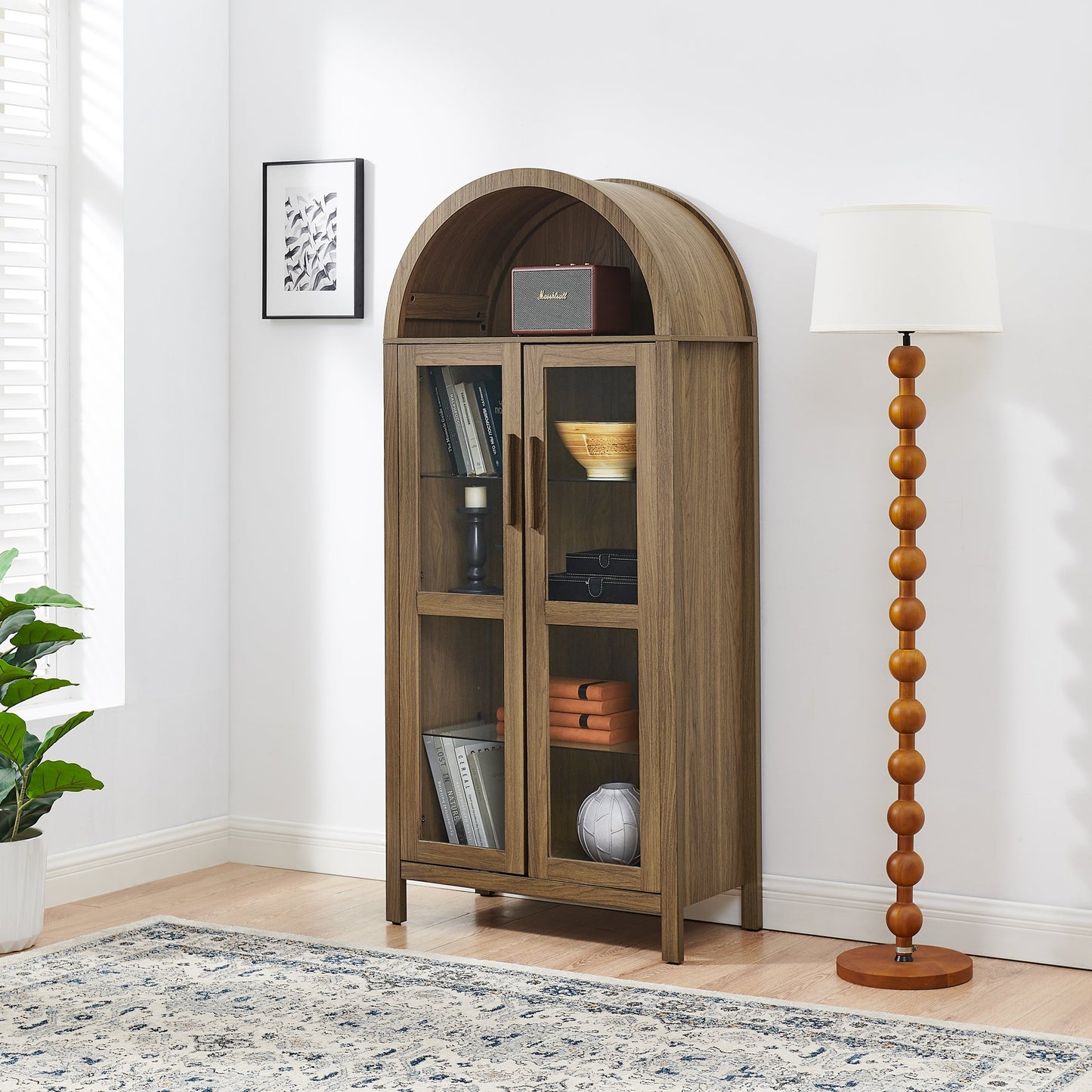 High arched storage cabinet by HouseOfZazla in warm wood with glass-front doors on Tampa Home & Garden Store