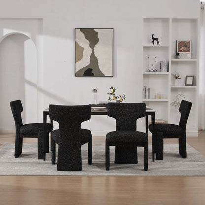 Six armless curved-back accent chairs in black textured fabric surround a dining table on Tampa Home & Garden Store