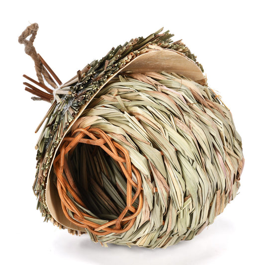 Hanging straw bird nest with woven dried grass and jute cord, natural beige and green hues on Tampa Home & Garden Store