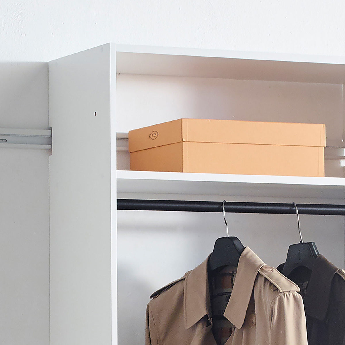 Wall-mounted white HouseOfZazla modular wardrobe with brown boxes on shelf and hanging rod on Tampa Home & Garden Store