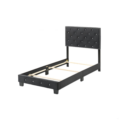 Luxurious upholstered bed with black tufted headboard and nailhead trim on Tampa Home & Garden Store