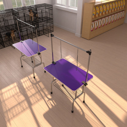 2 folding dog grooming tables with stainless frames and purple mats; adjustable arms near cages on Tampa Home & Garden Store