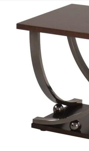 Isiah coffee table by HouseOfZazla with dark wood top and sculptural curved metal legs on Tampa Home & Garden Store