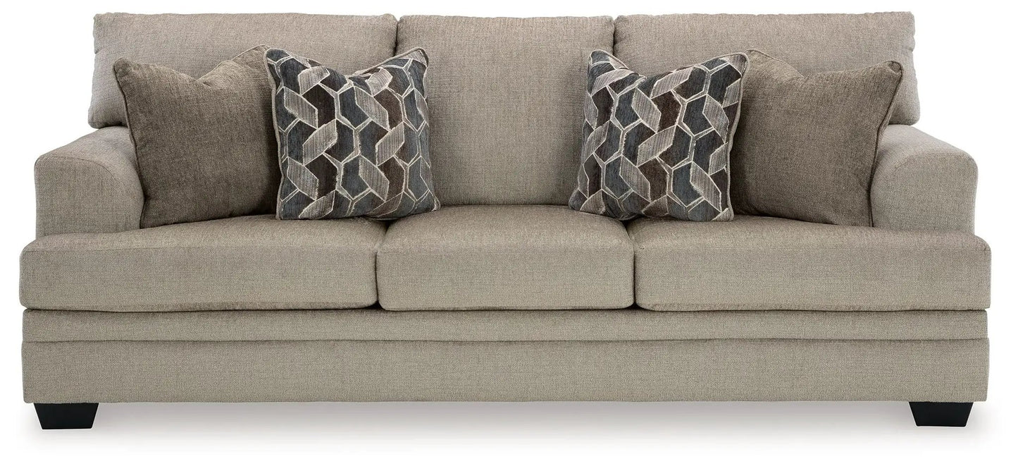 Stonemeade sofa by Unique Piece Furniture, beige sofa with two geometric-pattern pillows on Tampa Home & Garden Store