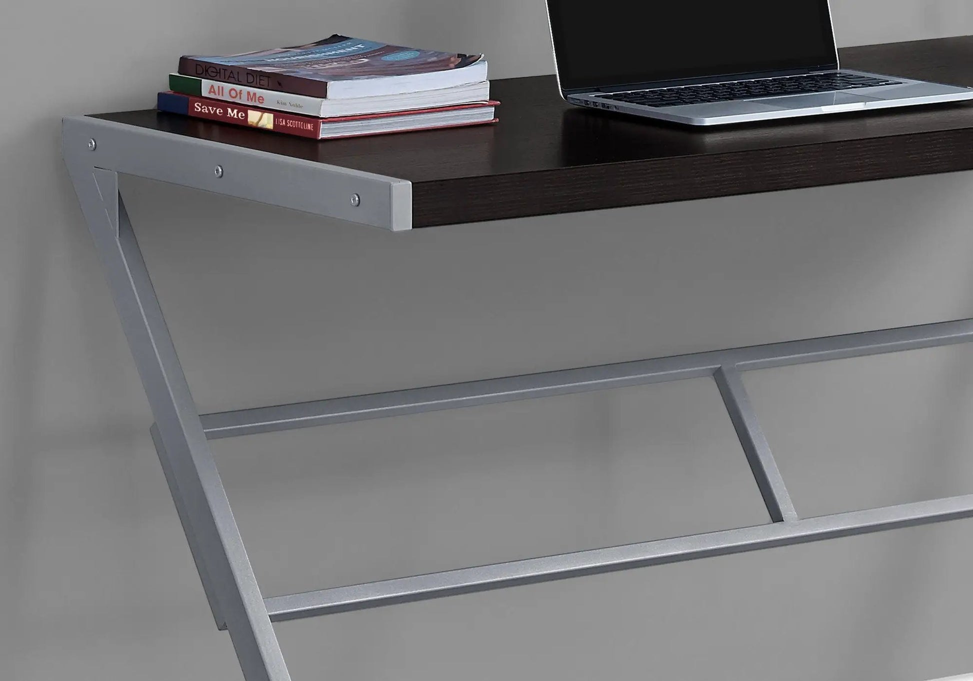 Computer desk by Unique Piece Furniture with dark wood top and silver metal frame, laptop on Tampa Home & Garden Store