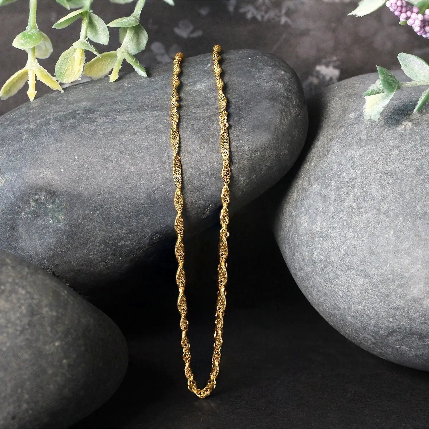 10k yellow gold Singapore chain necklace 1.80 mm by Bids.com, two chains displayed on rocks on Tampa Home & Garden Store
