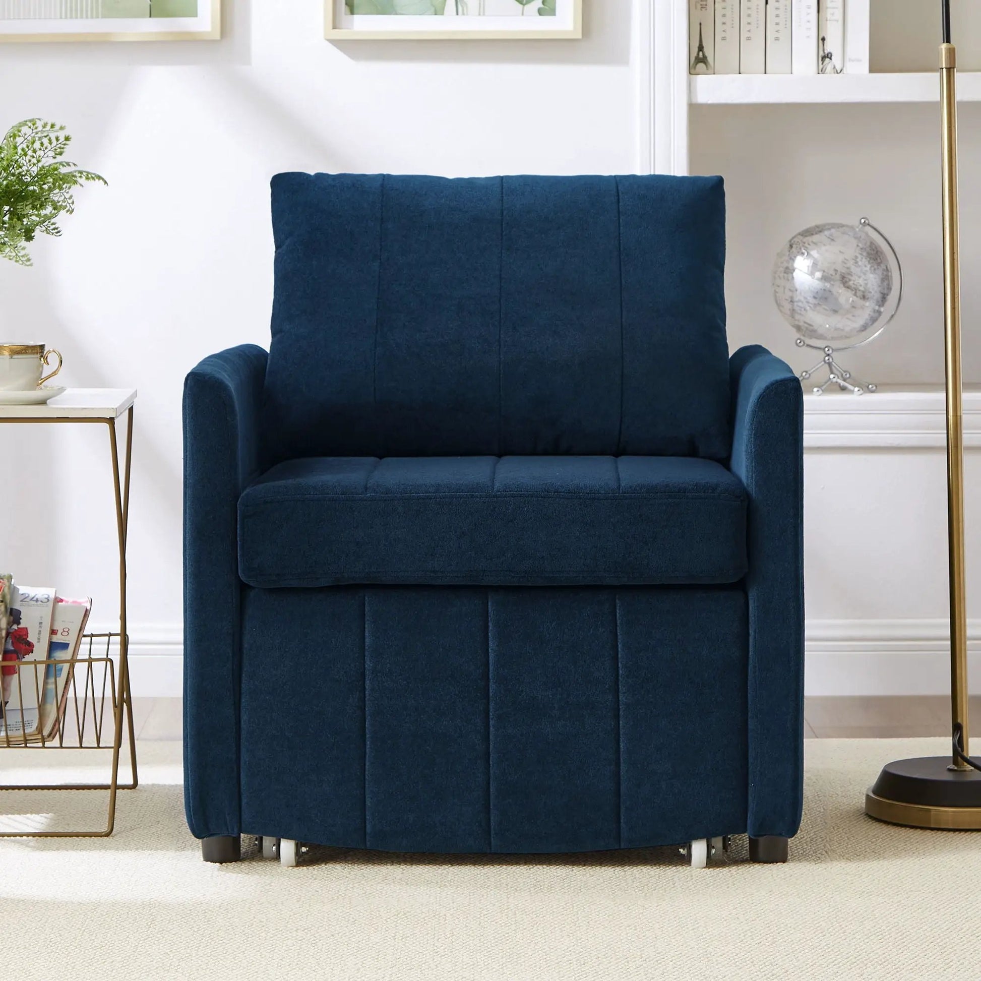 Futon chair in dark blue upholstery with tufted back in a modern living room on Tampa Home & Garden Store