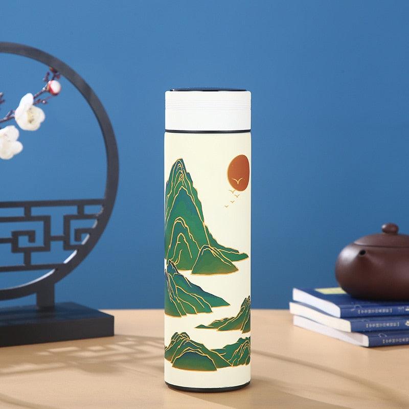 Stevvex 450ml stainless steel thermos with cream body and green mountain art, white lid on Tampa Home & Garden Store