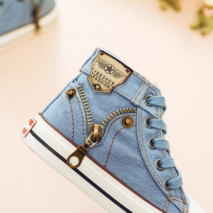 Denim blue high-top toddler sneaker with side zipper and lace-up front, striped white sole on Tampa Home & Garden Store