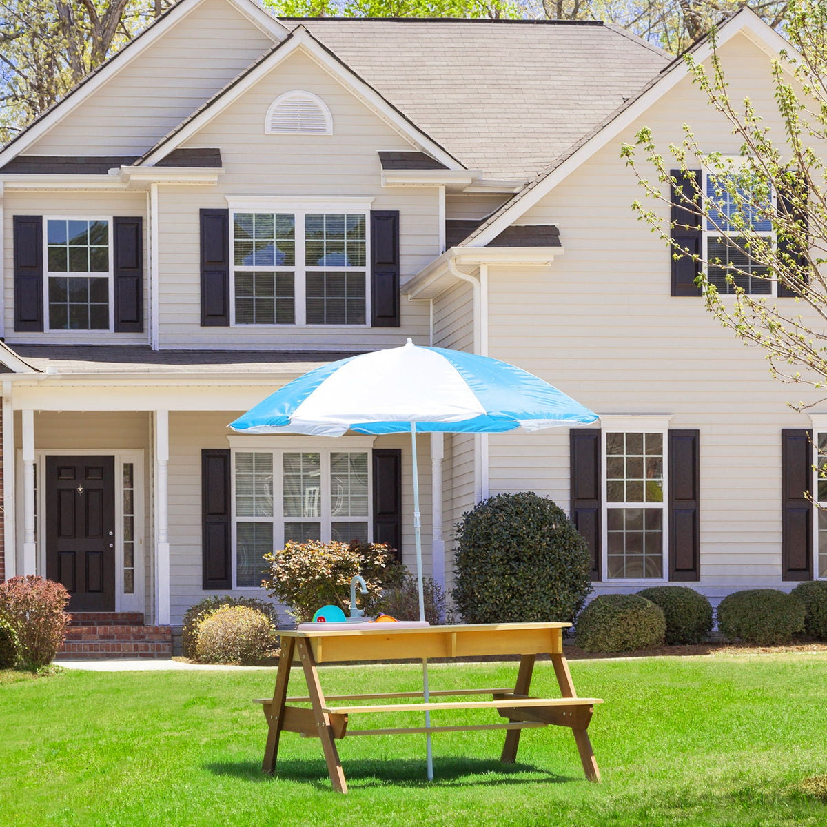 HouseOfZazla cedar outdoor kids picnic table with sand and water play under a blue umbrella on Tampa Home & Garden Store