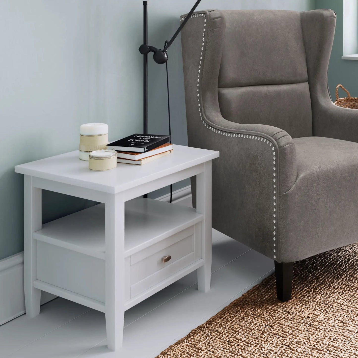 Warm Shaker coffee table in white wood with drawer and shelves beside gray upholstered armchair on Tampa Home & Garden Store