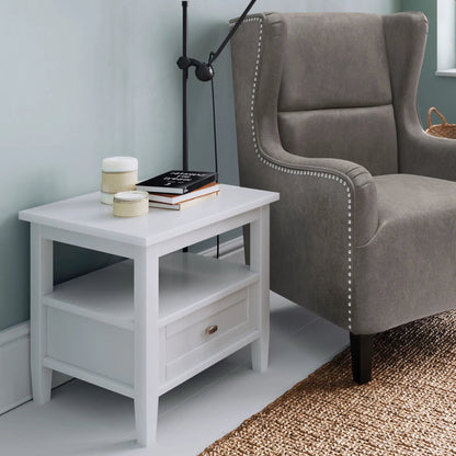 Warm Shaker coffee table in white wood with drawer and shelves beside gray upholstered armchair on Tampa Home & Garden Store