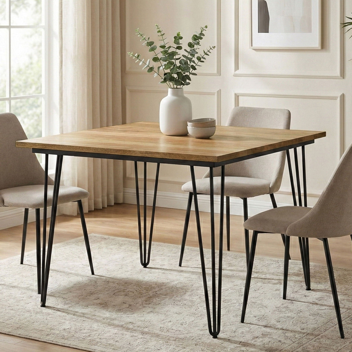 Square mango wood dining table with black hairpin legs in a neutral dining room on Tampa Home & Garden Store