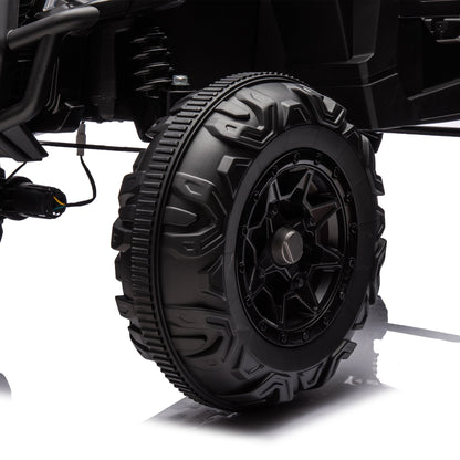 Side by Side 4x4 ride-on off-road truck tire close-up with rugged tread and suspension on Tampa Home & Garden Store