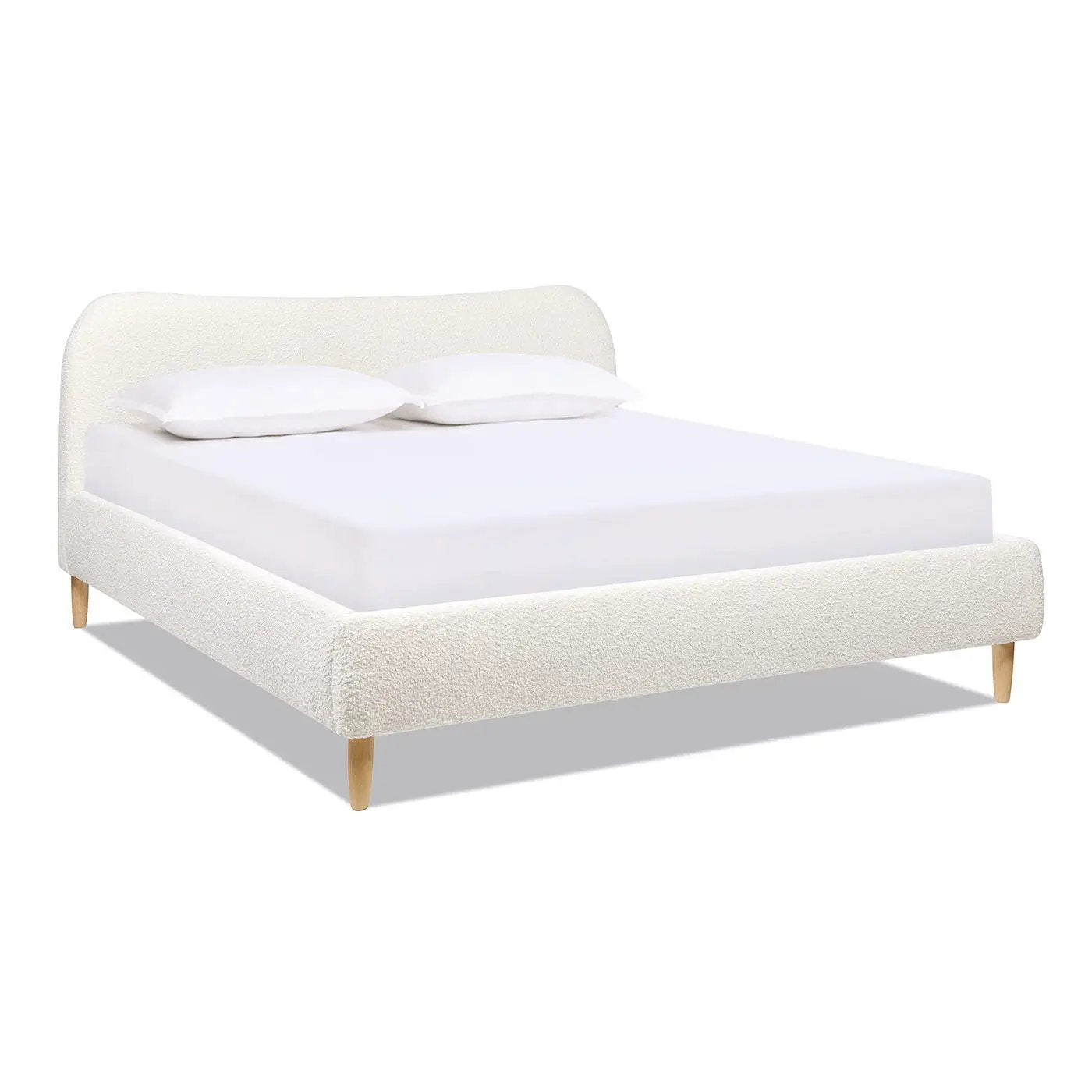Roman curved headboard upholstered platform bed in ivory boucle with wooden legs on Tampa Home & Garden Store