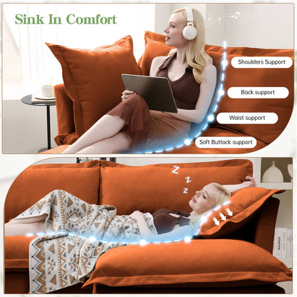 Slip-Covered Armchair with Cushions in burnt orange, seated woman with tablet and headphones on Tampa Home & Garden Store