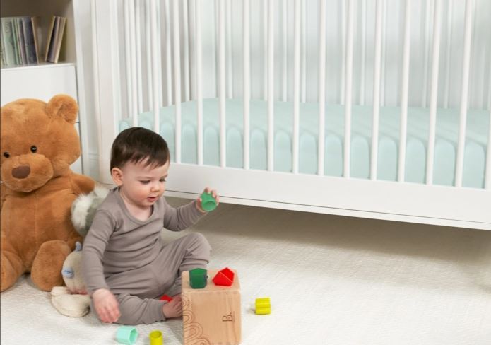 BedGear Dri-Tec Crib Sheet light green crib bedding in a nursery with a baby and blocks on Tampa Home & Garden Store