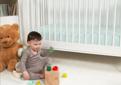 BedGear Dri-Tec Crib Sheet light green crib bedding in a nursery with a baby and blocks on Tampa Home & Garden Store