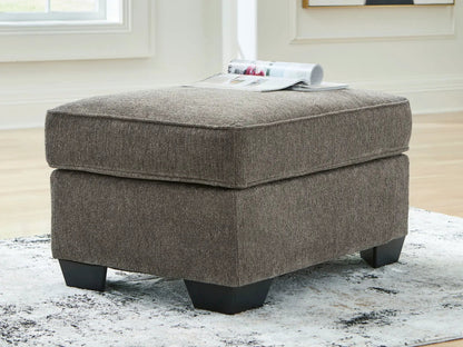 Olten Stationary Chair & Ottoman brown textured upholstery; stacked ottomans with magazine on Tampa Home & Garden Store