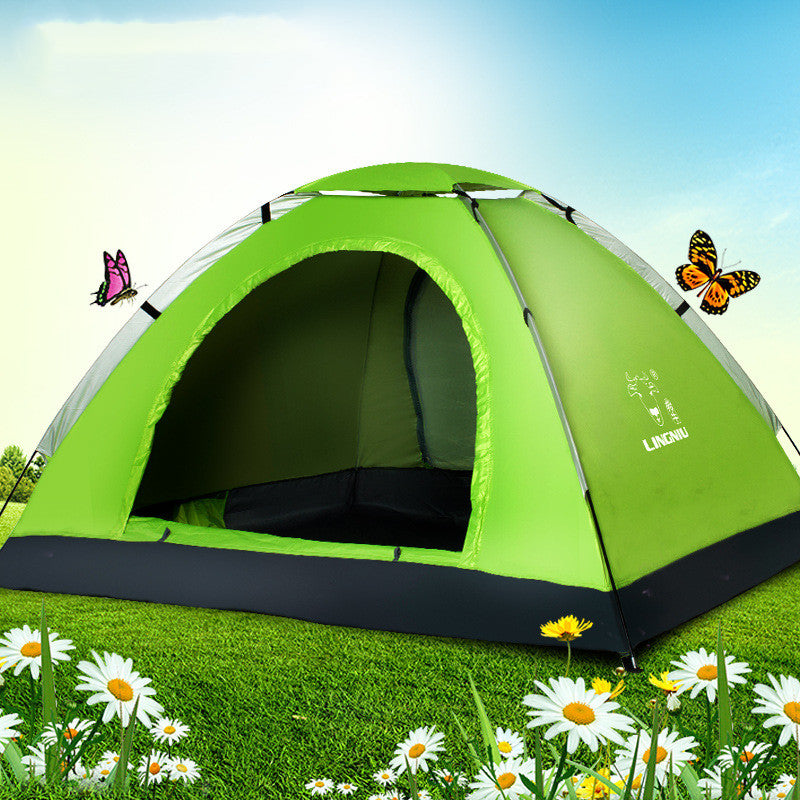 Green single-layer camping tent with open doorway on a grassy field with daisies on Tampa Home & Garden Store