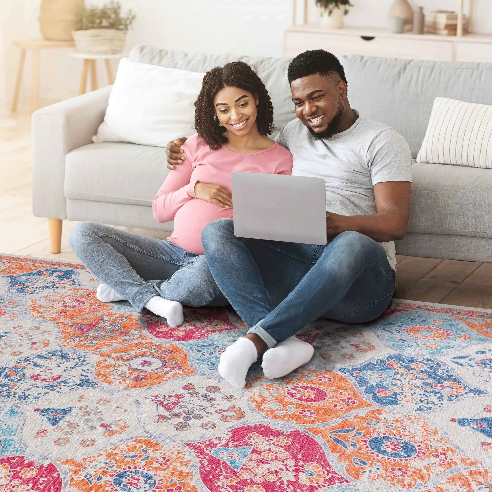 Maval area rug by Unique Piece Furniture with vibrant pink orange blue floral pattern on Tampa Home & Garden Store