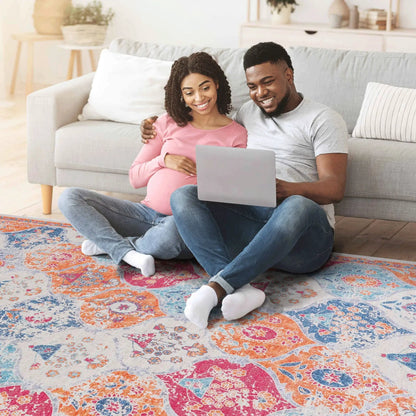 Maval area rug by Unique Piece Furniture with vibrant pink orange blue floral pattern on Tampa Home & Garden Store