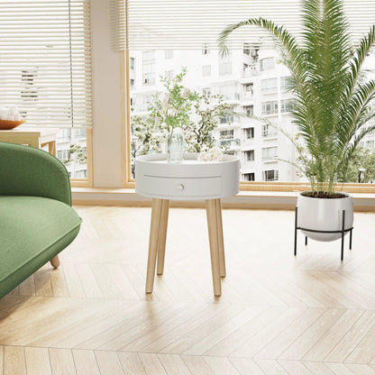 White round accent nightstand with storage drawer and light wood legs in a bright bedroom on Tampa Home & Garden Store