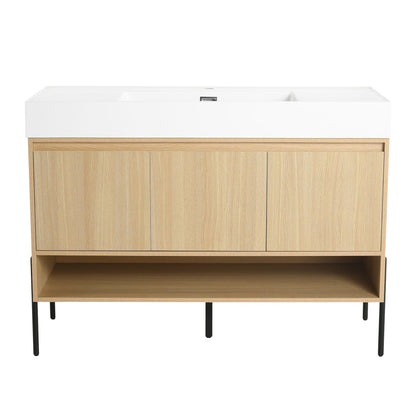 Modern bathroom vanity with white resin sink atop a light oak cabinet and slim black legs on Tampa Home & Garden Store