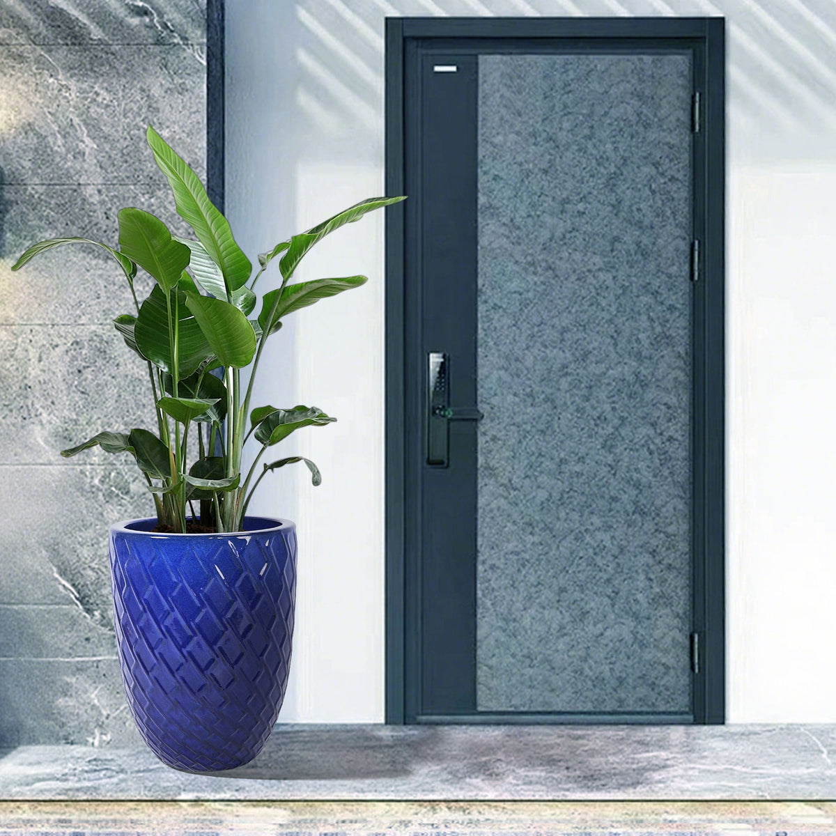 Blue ceramic planter by HouseOfZazla with a diamond-pattern texture and green leaves on Tampa Home & Garden Store