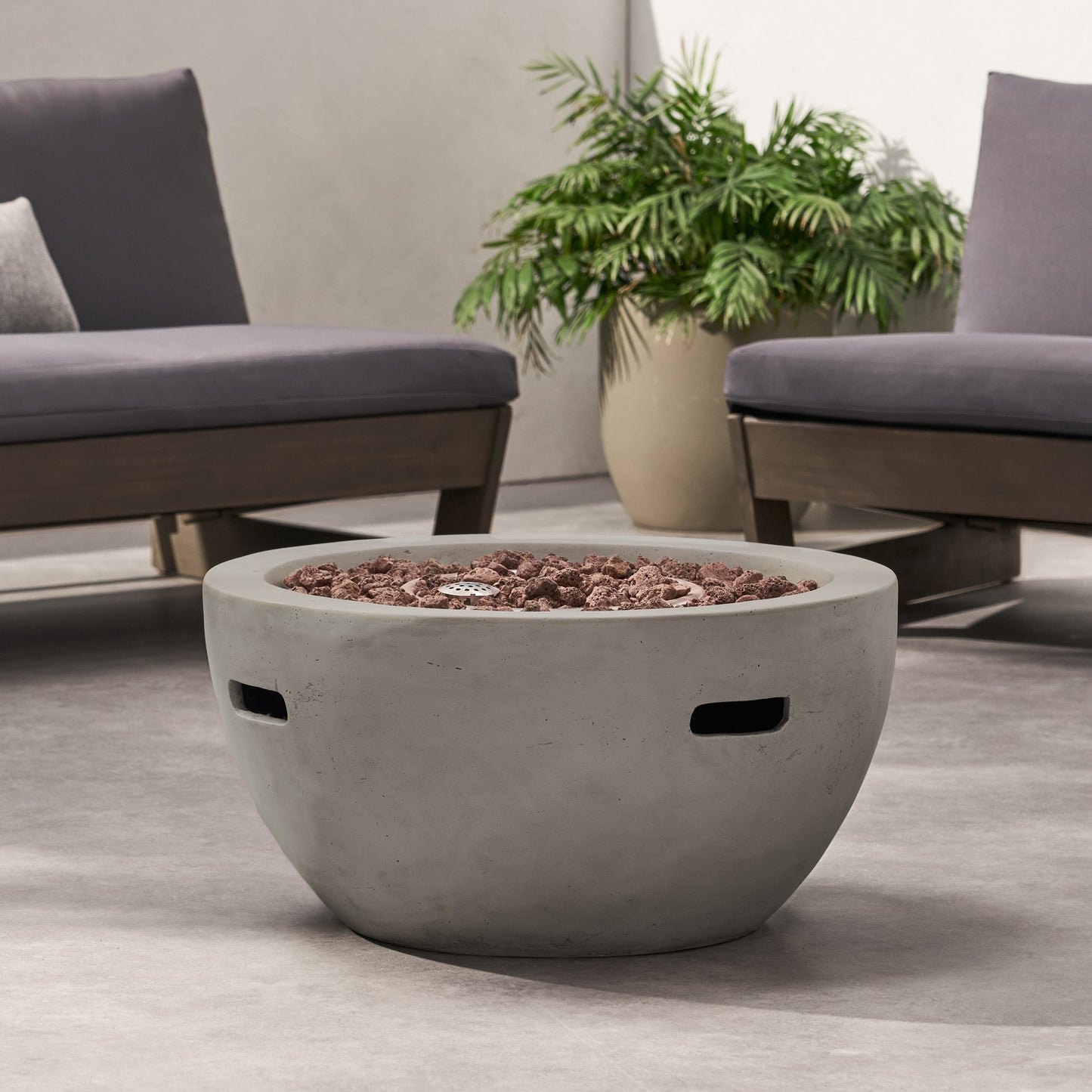 HouseOfZazla 27-inch light gray bowl-shaped propane fire pit with lava rocks and burner on Tampa Home & Garden Store