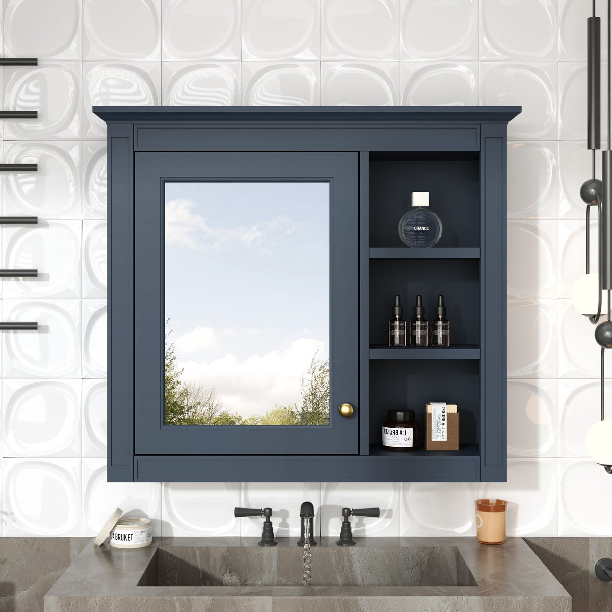 Wall-mounted navy blue medicine cabinet with mirror and 3 open shelves displaying bottles including Chanel perfume on Tampa Home & Garden Store