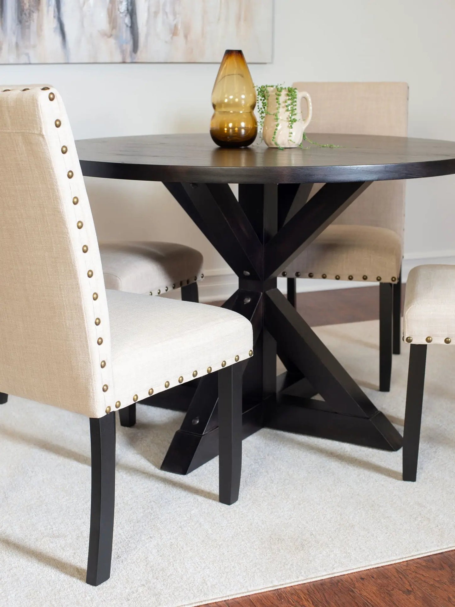 Mytzi 5 Piece Dining Set black cross-buck table with 4 beige upholstered chairs on Tampa Home & Garden Store